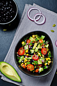 Black beans corn avocado red onion tomato salad with lime dressing