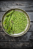 Green Peas and Pods in a Metal Plate