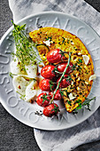 Courgette omlette with herbs, tomatoes, kohlrabi carpaccio and dill flowers