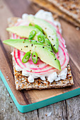 Baked crispbread with cottage cheese, striped beetroot and avocado