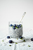 Chia pudding with blueberries, pumpkin seeds, and coconut