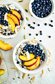 Chia pudding with nectarines, blueberries, and coconut flakes