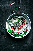 Baba Ghanoush with herbs, olive oil, and pomegranate