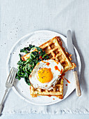 Cheese and courgette waffles with spinach and fried egg