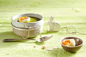 Spinach soup with boiled eggs for Easter