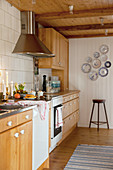 Country-house kitchen with wooden cabinets