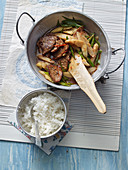 Stir fried asparagus with pork fillets and basmati rice