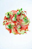Avocado and tomato salad with basil