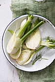 Fennel in a white bowl and a green napkin