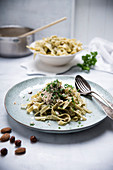 Vegan spinach tagliatelle with a hazelnut and almond sauce
