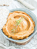Vegan chestnut hummus with bean sprouts and sesame seeds