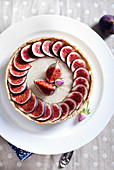 Fig mousse tart decorated with rose buds