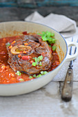 Osso buco (braised, cross-cut veal shanks, Italy)