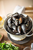 Raw mussels in colander
