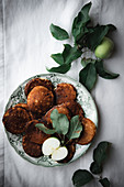 Apple pancakes on a plate (top view)