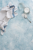 Surface with icing sugar and teatowel