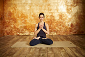 A woman in a lotus position (yoga)