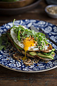 Toast with avocado, egg and greens