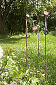 Peonies on wooden rods decorating garden