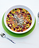 Hearty minestrone soup with kidney beans, sweetcorn and peas
