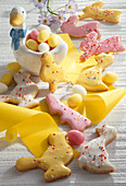 Colourful Easter biscuits with yellow ribbon and Easter eggs