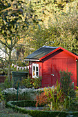 Allotment shed decorated with bunting in autumn