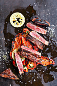 Grilled 'Grand Muh' (rumpsteak) with pointed peppers and salted lemons