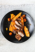 Grilled duck breast with sweet potato three ways