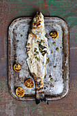Grilled sea bass with caper oil