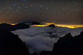 Night sky over cloud-filled Caldera de Taburiente