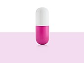 Pink and white capsule