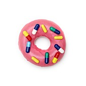 Pink doughnut with capsules
