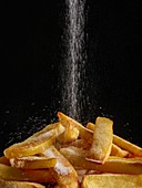 Salt pouring onto chips