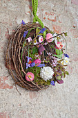 Wreath of maidenhair vine tendrils and spring flowers