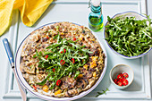 Frittata with mushrooms, red and yellow peppers, rocket and fresh chillies