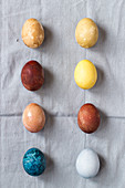 Eggs, coloured with natural dyes: Blue - red cabbage, yellow - turmeric, brown - red onion, red - beets, light green - spinach, light brown - tea