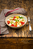 Tortellini salad with tomatoes, mozzarella and basil