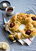 Greek Easter bread with boiled eggs, served with tea and butter