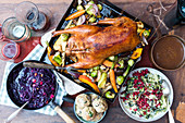 Roast goose with oven-roasted vegetables, bread dumplings, apple red cabbage, creamy savoy cabbage and lingo berry compote