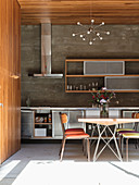 Dining area in kitchen with wood-clad walls