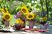 Bouquets of sunflowers, roses and perennials
