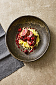 Marinated saddle of venison with pepper cherries and pointed cabbage