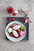 Poppyseed and yoghurt mouse in a pool of raspberry sauce