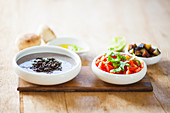 Black lentils, tomatoes and eggplants for making Sabich (sandwich, Israel)
