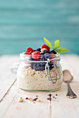 Overnight oats with fresh berries in a flip-top jar