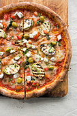 Feta and Vegetable Pizza on a wooden board