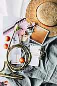 Summery mood board with straw hat and product photos