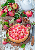Pie with baked custard cream and apple roses