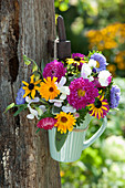 Small Bouquet Of Summer Asters, Vetches, Marigolds And Sun Hat In A Cup