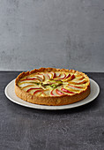 Leek and apple quiche with smoked trout